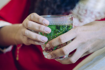 Close-up of woman holding drink