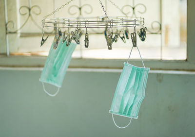 Close-up of clothespins hanging on clothesline