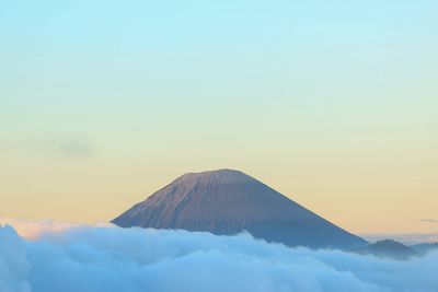 View of snowcapped mountain against cloudy sky