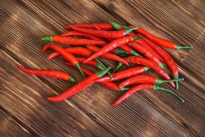 Close-up of red chili peppers on table