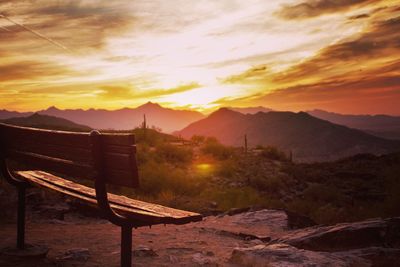 Scenic view of mountains against orange sky