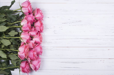 Close-up of pink rose on table