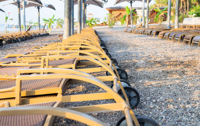 Close-up of empty chairs in street