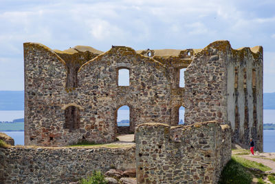 Old building against cloudy sky