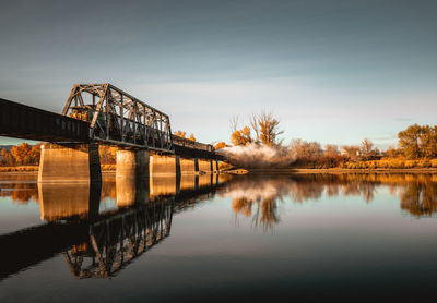 Steaming train on the train bridge 