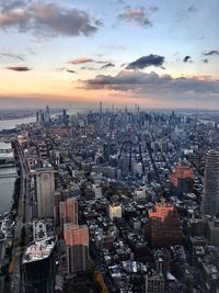 Aerial view at sunset of the island of manhattan looking uptown and the hudson river to the east.