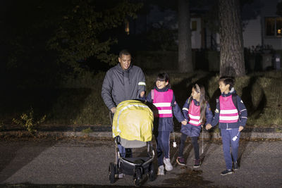 Father with daughter walking in evening