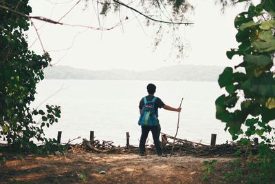 Full length of woman standing in water