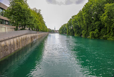 River amidst trees against sky