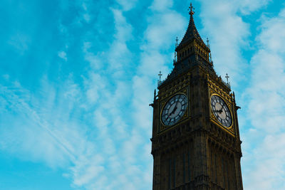 Low angle view of clock tower against sky