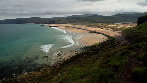 Scenic view of beach against sky