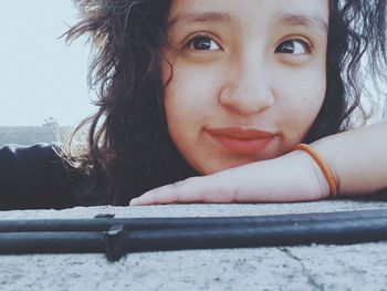 Close-up portrait of smiling young woman