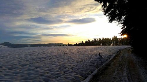 Scenic view of sea at sunset