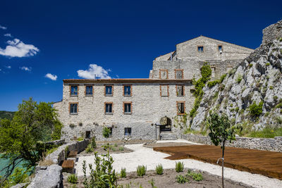 Low angle view of old ruins against sky