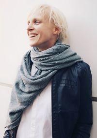 Portrait of smiling woman standing in snow