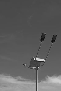 Low angle view of street light against sky