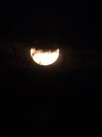 Low angle view of moon against sky at night