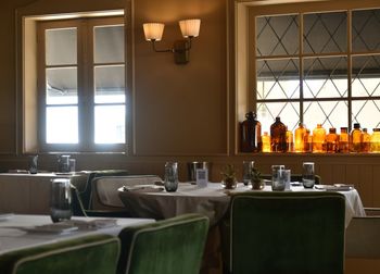 Empty chairs and tables in restaurant