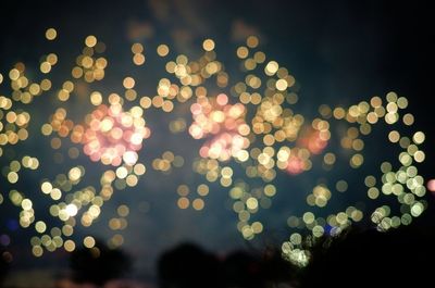 Illuminated lamp post at night