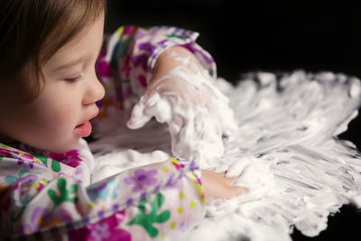 Close-up of cute girl with eyes closed