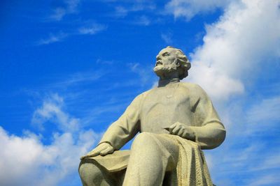 Low angle view of statue against sky