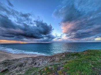 Scenic view of sea against sky during sunset