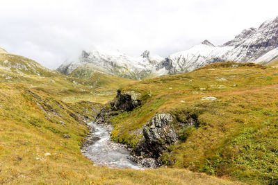 Landscape with stream in swiss alps