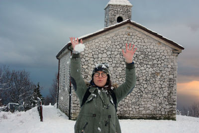 Full length of woman standing on snow