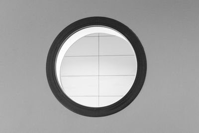 Low section of circle window on wall in building