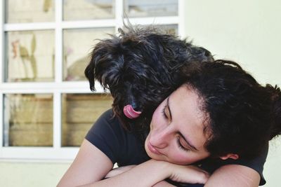 Close-up of black dog yawning