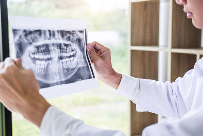 Dentist analyzing x-ray at clinic