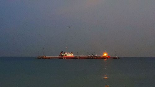 Scenic view of sea against dramatic sky