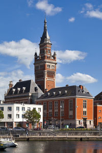 Dunkerque, france - june 22 2020. port du bassin du commerce and the belfry of the dunkirk city hall