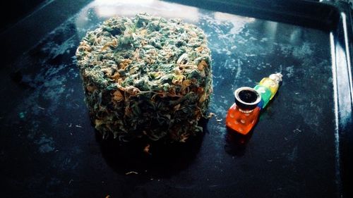 High angle view of cigarette in container on table