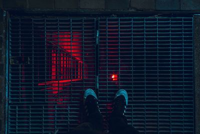 Low section of man against brick wall