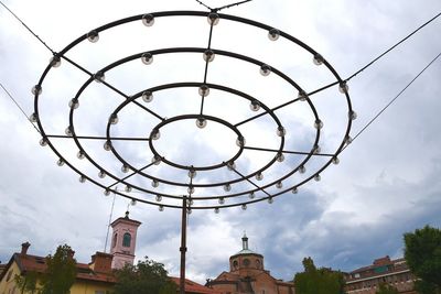 High section of built structures against clouds sky