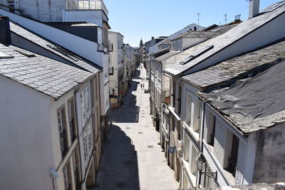 Street amidst buildings against sky