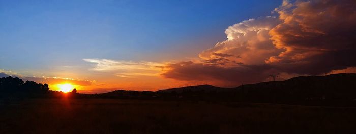 Scenic shot of silhouette mountains against sky at sunset