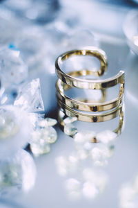 Close-up of wedding rings on table