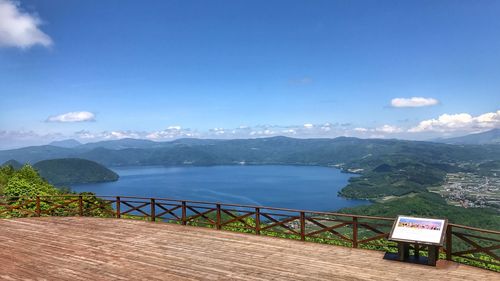 Scenic view of mountains against blue sky