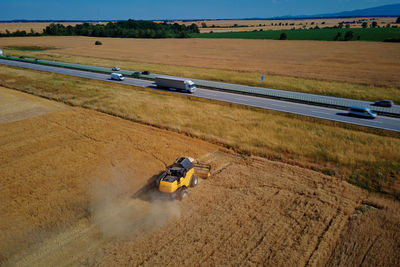 Combine harvester working in agricultural field. harvest season
