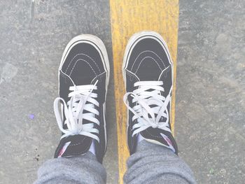 Low section of person standing on ground