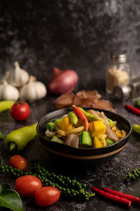 Close-up of chili peppers and vegetables on table