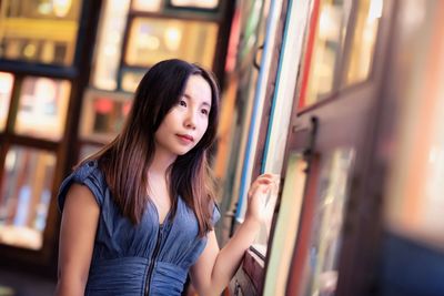 Young woman looking towards window in restaurant 