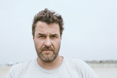 Portrait of bearded man on the beach