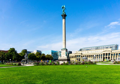 Jubilee column against blue sky at schlossplatz in city