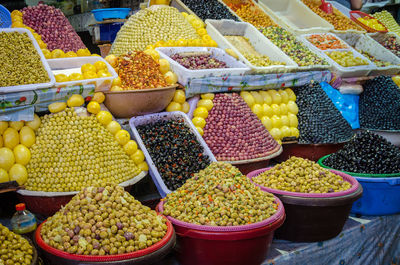 Variety of olives for sale at market stall in soukh of fes, morocco