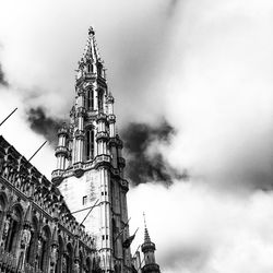 Low angle view of church against cloudy sky