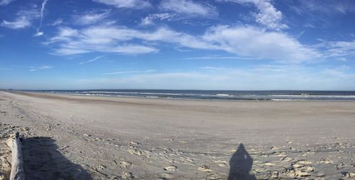 Scenic view of sea against blue sky