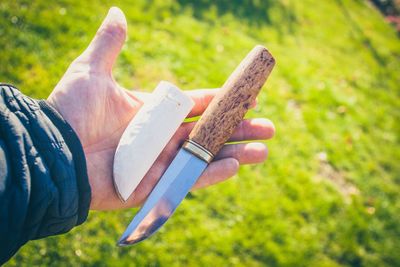 Close-up of hand holding knife